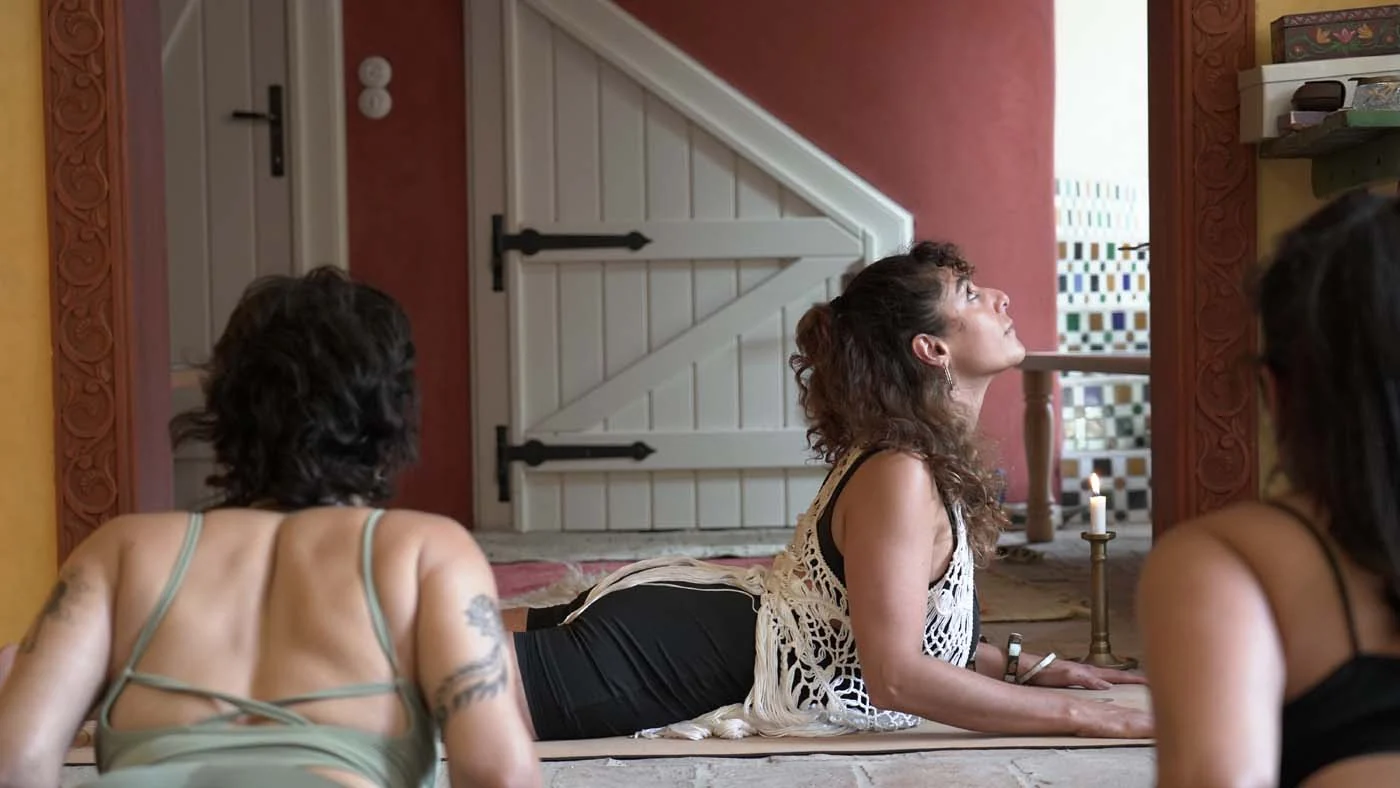 A guided yoga practice in an intimate room